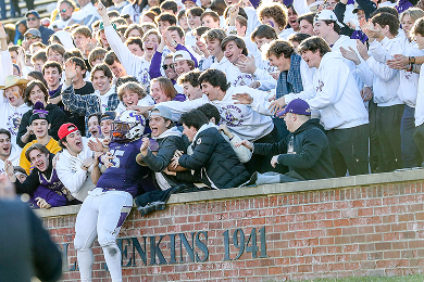 Fans supporting high school teams
